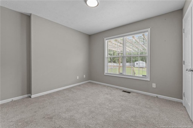 159 Falling Leaf Dr, Raeford, NC 28376 - empty room featuring carpet flooring and a textured ceiling