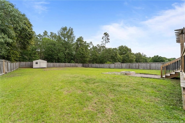 159 Falling Leaf Dr, Raeford, NC 28376 - fenced backyard featuring a storage shed and a fire pit
