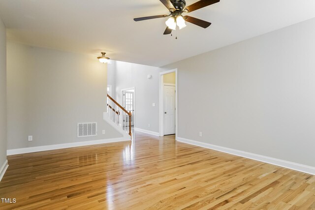165 Sutherland Dr, Franklinton, NC 27525 - spare room with stairway, ceiling fan, and light wood-style flooring