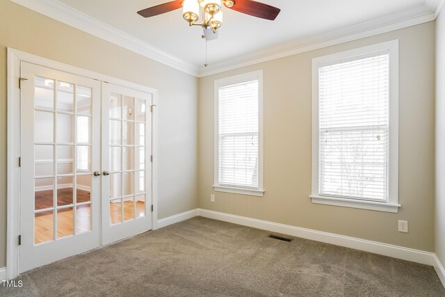 165 Sutherland Dr, Franklinton, NC 27525 - carpeted empty room featuring french doors, ornamental molding, a ceiling fan, and healthy amount of natural light