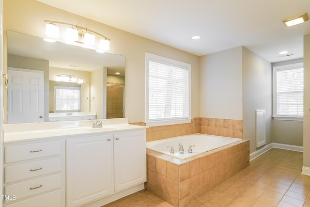 165 Sutherland Dr, Franklinton, NC 27525 - full bath featuring a garden tub, vanity, tile patterned flooring, and recessed lighting