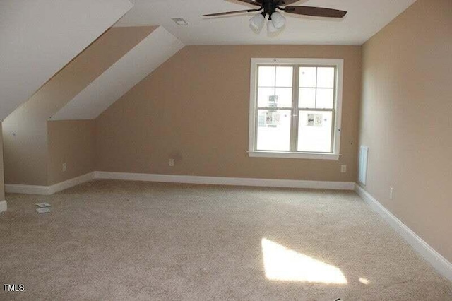 80 Scarlet Bell Dr, Youngsville, NC 27596 - additional living space with a ceiling fan, light carpet, and lofted ceiling