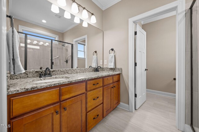 80 Scarlet Bell Dr, Youngsville, NC 27596 - bathroom featuring a stall shower, double vanity, and ornamental molding