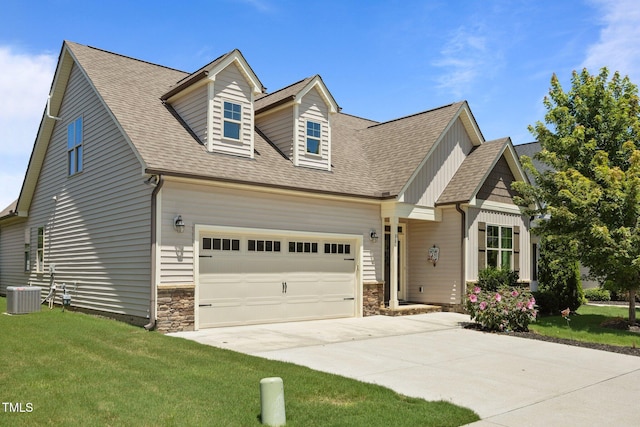 80 Scarlet Bell Dr, Youngsville, NC 27596 - view of front of home with concrete driveway, a front yard, stone siding, a garage, and roof with shingles