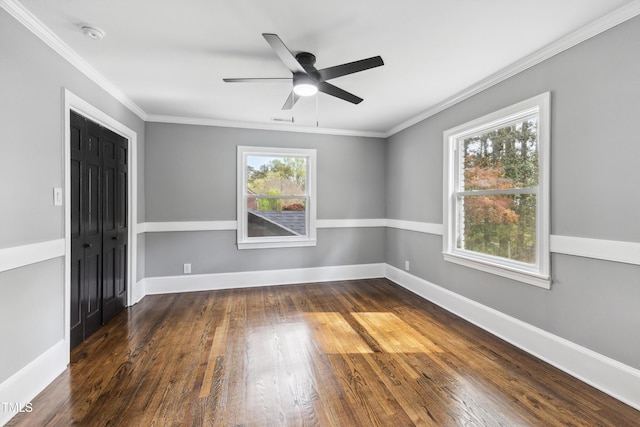 1112 Lakeside Dr NW, Wilson, NC 27896 - spare room featuring healthy amount of natural light, wood finished floors, ceiling fan, a smoke detector, and crown molding