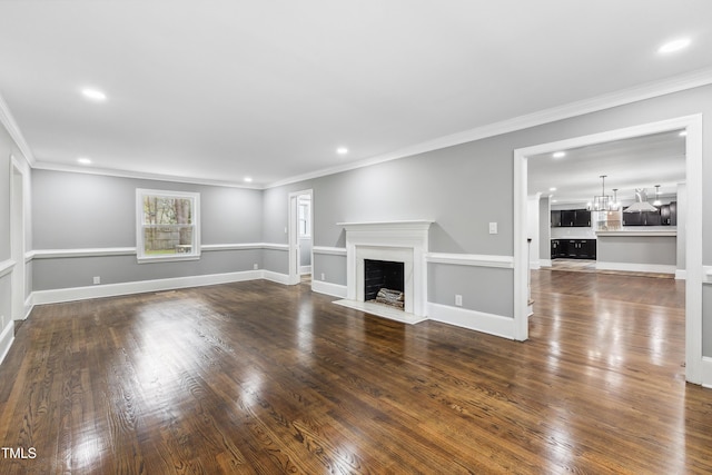 1112 Lakeside Dr NW, Wilson, NC 27896 - unfurnished living room featuring ornamental molding, recessed lighting, dark wood-style flooring, and a fireplace with flush hearth