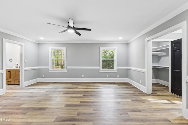 1112 Lakeside Dr NW, Wilson, NC 27896 - spare room with ornamental molding, healthy amount of natural light, ceiling fan, wood finished floors, and recessed lighting