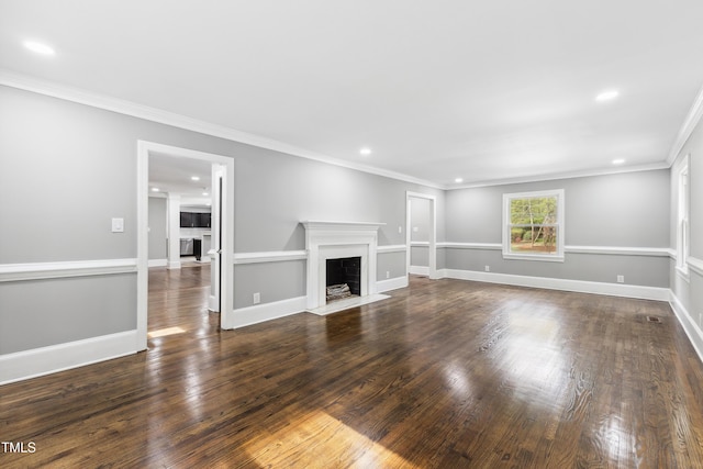 1112 Lakeside Dr NW, Wilson, NC 27896 - unfurnished living room featuring a fireplace with flush hearth, recessed lighting, ornamental molding, and dark wood-style floors