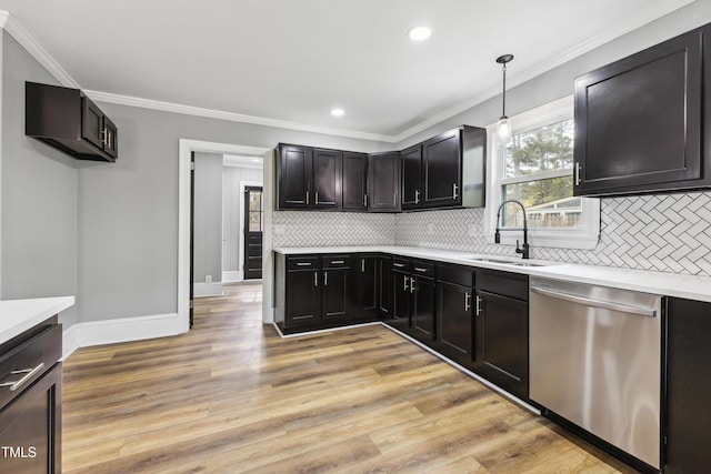 1112 Lakeside Dr NW, Wilson, NC 27896 - kitchen with stainless steel dishwasher, decorative backsplash, light countertops, recessed lighting, and ornamental molding