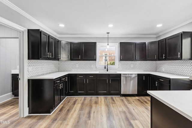1112 Lakeside Dr NW, Wilson, NC 27896 - kitchen featuring dishwasher, light wood-style flooring, light countertops, dark cabinetry, and ornamental molding