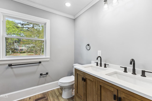 1112 Lakeside Dr NW, Wilson, NC 27896 - bathroom with crown molding, wood finished floors, and double vanity