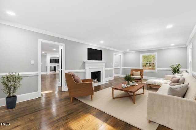 1112 Lakeside Dr NW, Wilson, NC 27896 - living room with a fireplace with flush hearth, recessed lighting, wood finished floors, and ornamental molding