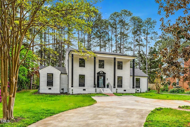1112 Lakeside Dr NW, Wilson, NC 27896 - neoclassical / greek revival house with crawl space, brick siding, a front lawn, and concrete driveway