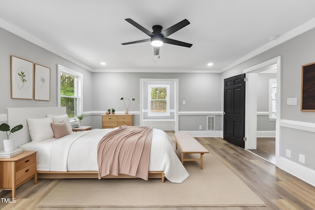 1112 Lakeside Dr NW, Wilson, NC 27896 - bedroom with multiple windows, ornamental molding, light wood-type flooring, recessed lighting, and a ceiling fan