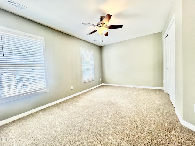 5419 Vista View Ct, Raleigh, NC 27612 - unfurnished bedroom with carpet floors, a closet, multiple windows, and a ceiling fan