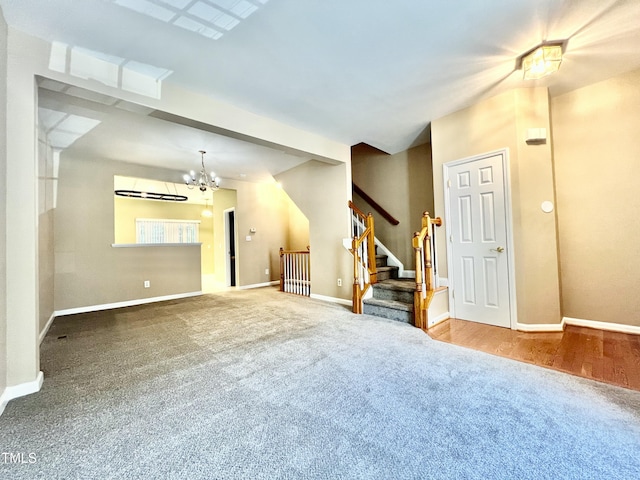 5419 Vista View Ct, Raleigh, NC 27612 - unfurnished living room with carpet flooring, a chandelier, and stairs