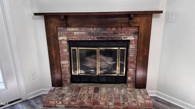 132 Carriage House Trl, Garner, NC 27529 - detailed view of wood finished floors and a fireplace