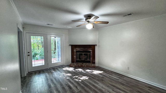132 Carriage House Trl, Garner, NC 27529 - unfurnished living room featuring wood finished floors, a ceiling fan, crown molding, and a brick fireplace