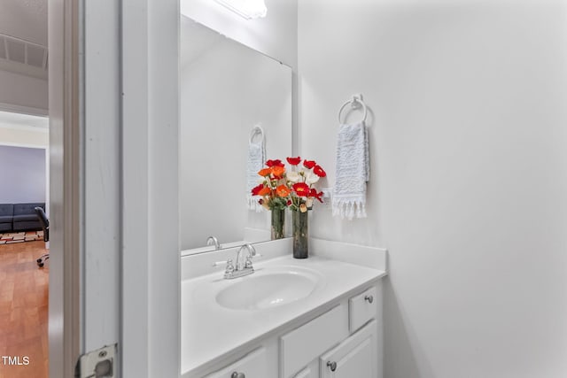 3109 Gold Dust Ln, Willow Springs, NC 27592 - bathroom with vanity and wood finished floors