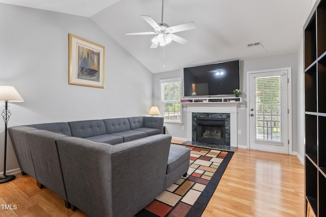 3109 Gold Dust Ln, Willow Springs, NC 27592 - living room featuring wood finished floors, ceiling fan, lofted ceiling, and plenty of natural light
