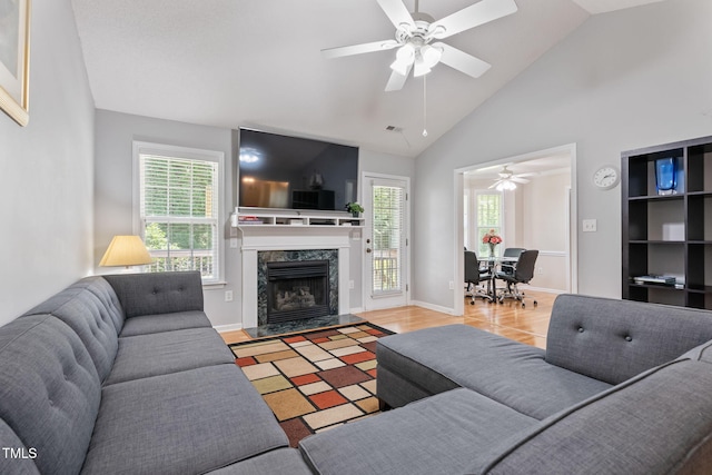 3109 Gold Dust Ln, Willow Springs, NC 27592 - living room with a ceiling fan, a premium fireplace, wood finished floors, and high vaulted ceiling