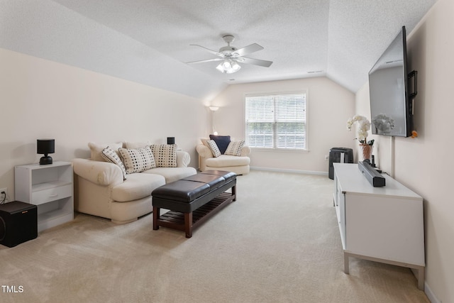3109 Gold Dust Ln, Willow Springs, NC 27592 - living area featuring lofted ceiling, a ceiling fan, light carpet, and a textured ceiling