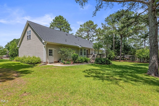 3109 Gold Dust Ln, Willow Springs, NC 27592 - back of house with a yard, a deck, and roof with shingles