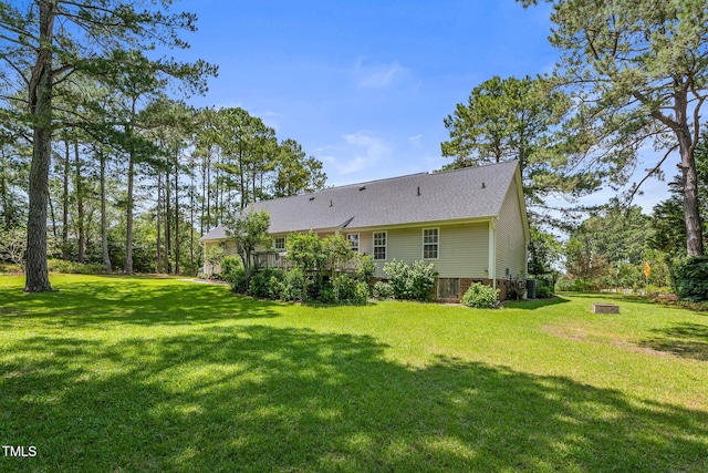 3109 Gold Dust Ln, Willow Springs, NC 27592 - rear view of house with a lawn, a fire pit, and roof with shingles