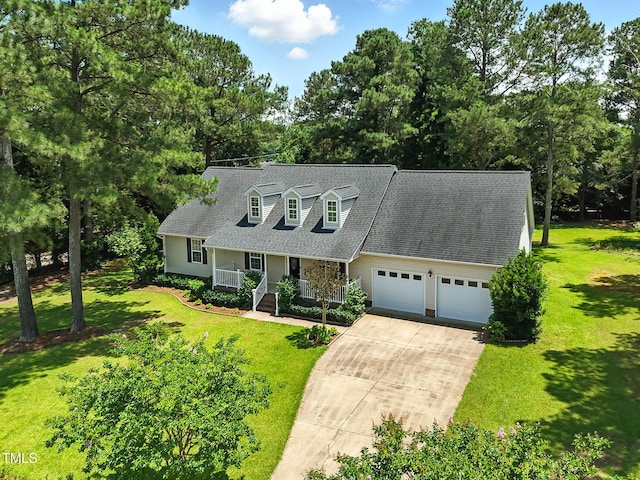 3109 Gold Dust Ln, Willow Springs, NC 27592 - new england style home with a porch, a garage, concrete driveway, and a front yard