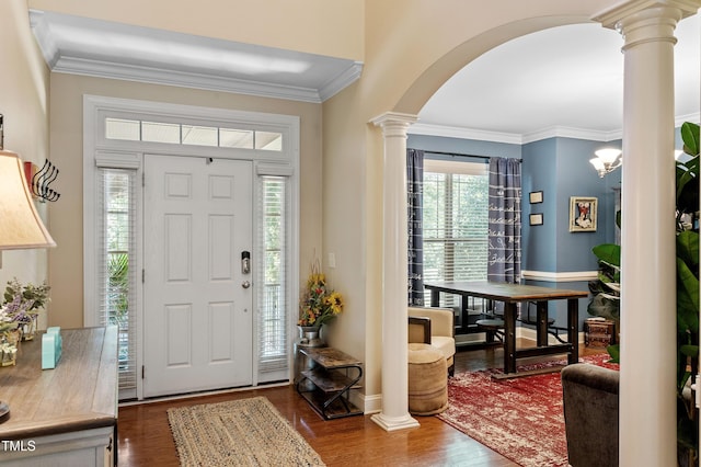 1413 Lily Creek Dr, Cary, NC 27518 - entrance foyer with decorative columns, arched walkways, dark wood finished floors, and crown molding