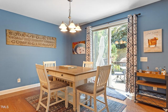 1413 Lily Creek Dr, Cary, NC 27518 - dining room with a chandelier and wood finished floors