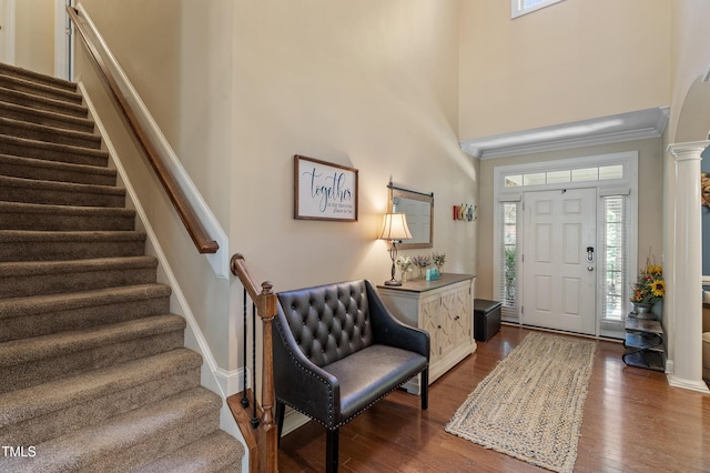 1413 Lily Creek Dr, Cary, NC 27518 - foyer entrance with stairway, plenty of natural light, dark wood-style flooring, a towering ceiling, and decorative columns