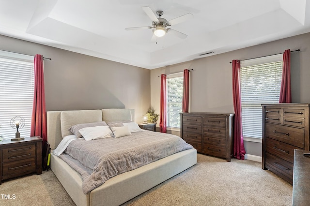 1413 Lily Creek Dr, Cary, NC 27518 - bedroom with a tray ceiling, light carpet, and ceiling fan