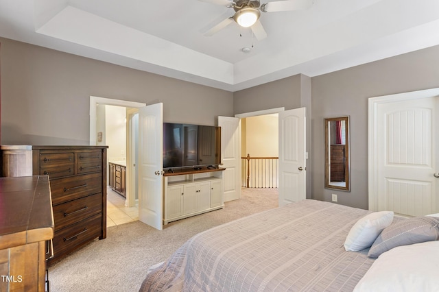 1413 Lily Creek Dr, Cary, NC 27518 - bedroom featuring light carpet, a raised ceiling, ensuite bath, and ceiling fan
