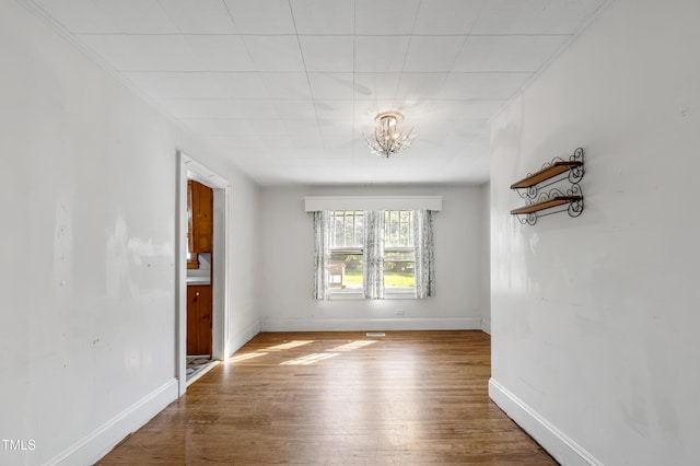 2715 E Geer St, Durham, NC 27704 - unfurnished room with a chandelier and wood finished floors