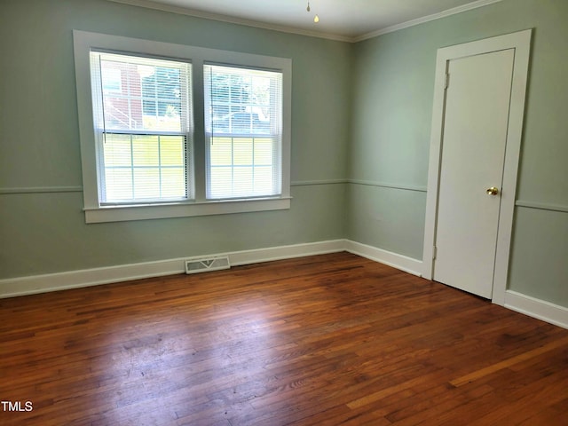 411 W Raleigh St, Siler City, NC 27344 - empty room with plenty of natural light, crown molding, and wood finished floors
