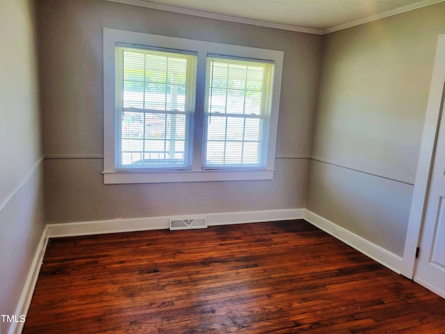 411 W Raleigh St, Siler City, NC 27344 - unfurnished room with healthy amount of natural light, dark wood-style flooring, and crown molding