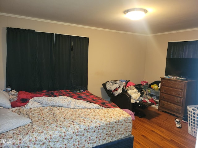 411 W Raleigh St, Siler City, NC 27344 - bedroom with wood finished floors and ornamental molding