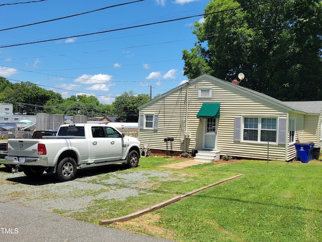 411 W Raleigh St, Siler City, NC 27344 - view of front of home with a front lawn and crawl space