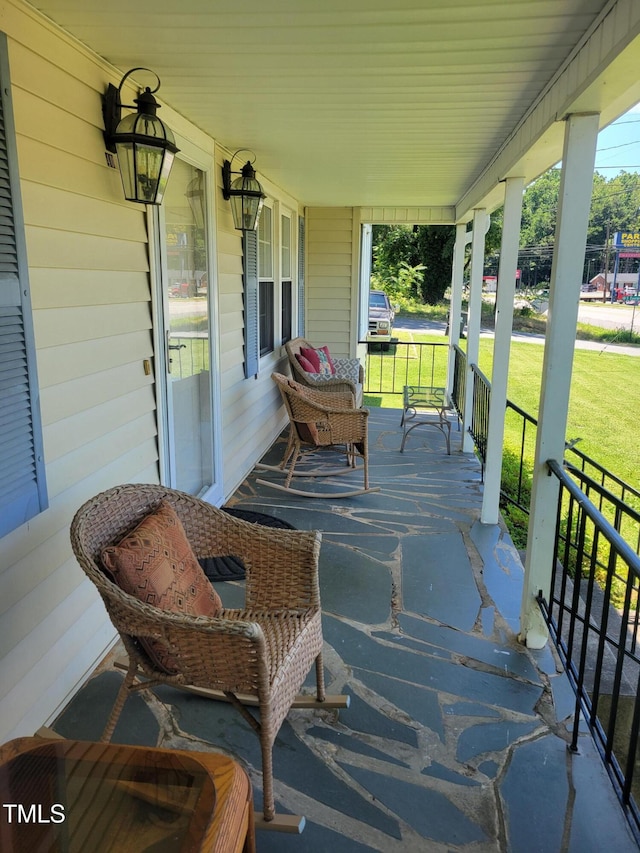 411 W Raleigh St, Siler City, NC 27344 - covered porch featuring a lawn