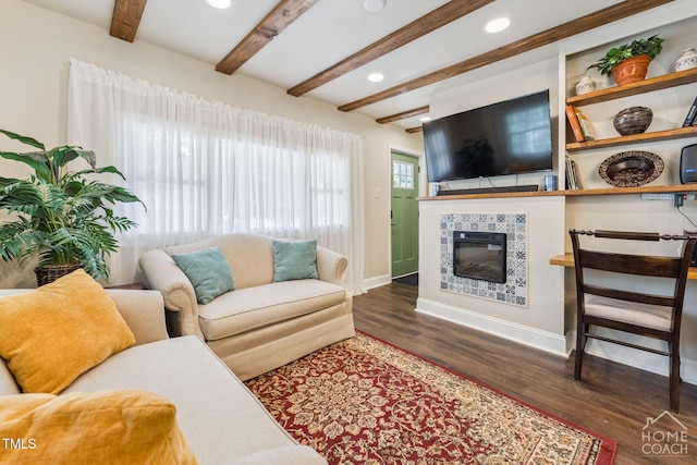 309 E End Ave, Durham, NC 27703 - living room featuring beamed ceiling, wood finished floors, a tiled fireplace, and recessed lighting