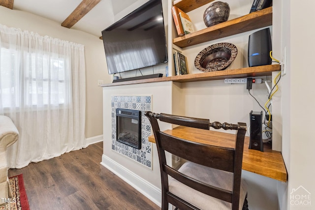 309 E End Ave, Durham, NC 27703 - dining area featuring dark wood finished floors, beam ceiling, and a tiled fireplace