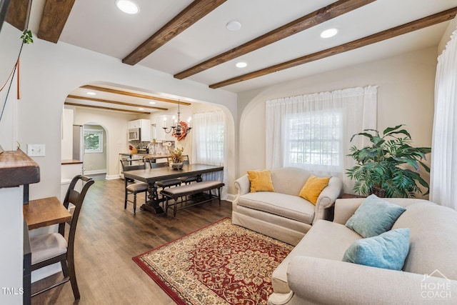 309 E End Ave, Durham, NC 27703 - living room with arched walkways, dark wood-type flooring, recessed lighting, beamed ceiling, and a chandelier