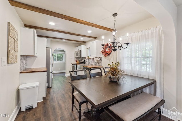 309 E End Ave, Durham, NC 27703 - dining space with arched walkways, a chandelier, beamed ceiling, dark wood finished floors, and recessed lighting