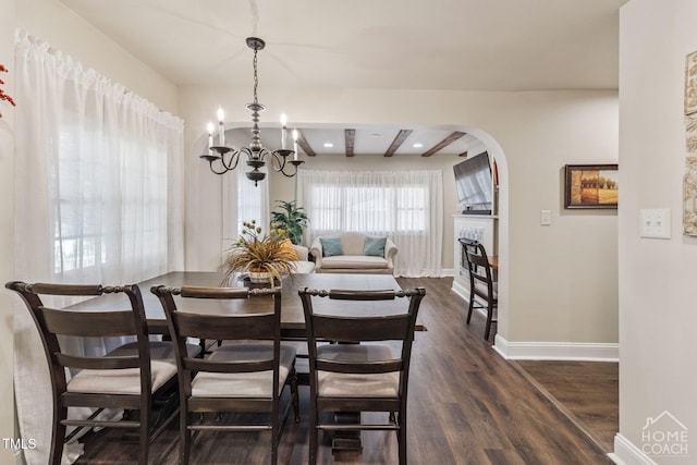 309 E End Ave, Durham, NC 27703 - dining area with a chandelier, arched walkways, and dark wood-type flooring