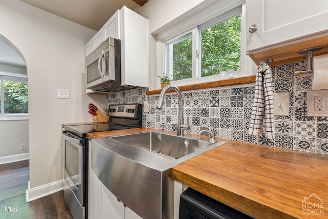 309 E End Ave, Durham, NC 27703 - kitchen with appliances with stainless steel finishes, wood counters, and plenty of natural light