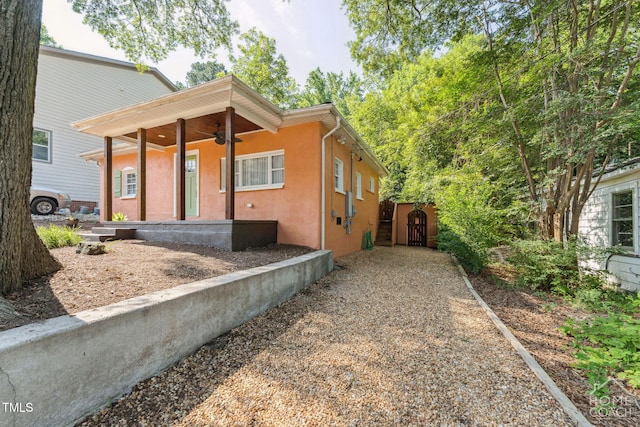 309 E End Ave, Durham, NC 27703 - view of front of house featuring ceiling fan, stucco siding, and a gate