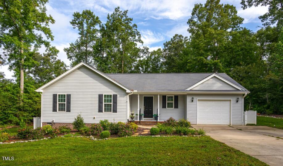 200 Cornerstone Dr, Franklinton, NC 27525 - ranch-style home featuring driveway, a garage, and a front lawn