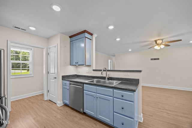 200 Cornerstone Dr, Franklinton, NC 27525 - kitchen with stainless steel dishwasher, dark countertops, light wood-style floors, a ceiling fan, and a peninsula