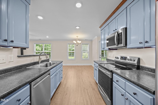 200 Cornerstone Dr, Franklinton, NC 27525 - kitchen with appliances with stainless steel finishes, dark countertops, light wood-style floors, a chandelier, and recessed lighting